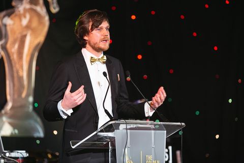 Filip Perkon presenting on stage at the Golden Unicorn Awards 2018