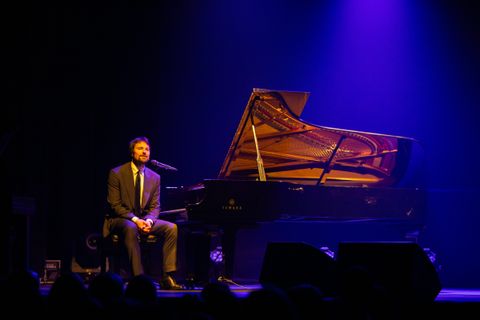 At the piano