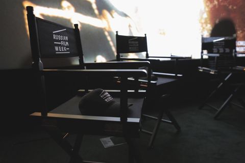 Russian Film Week branded director's chairs in front of a cinema screen
